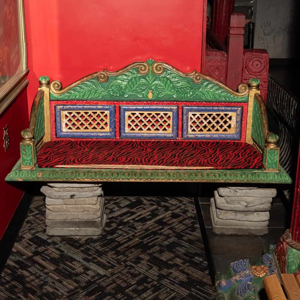 Ornate Carved Indo-Portuguese Style Bench: Striking settee captures the vibrant essence of Indo-Portuguese or Anglo-Indian provincial furniture, featuring a high, triple-panel back with intricate pierced lattice "jali" work and a crown of deep