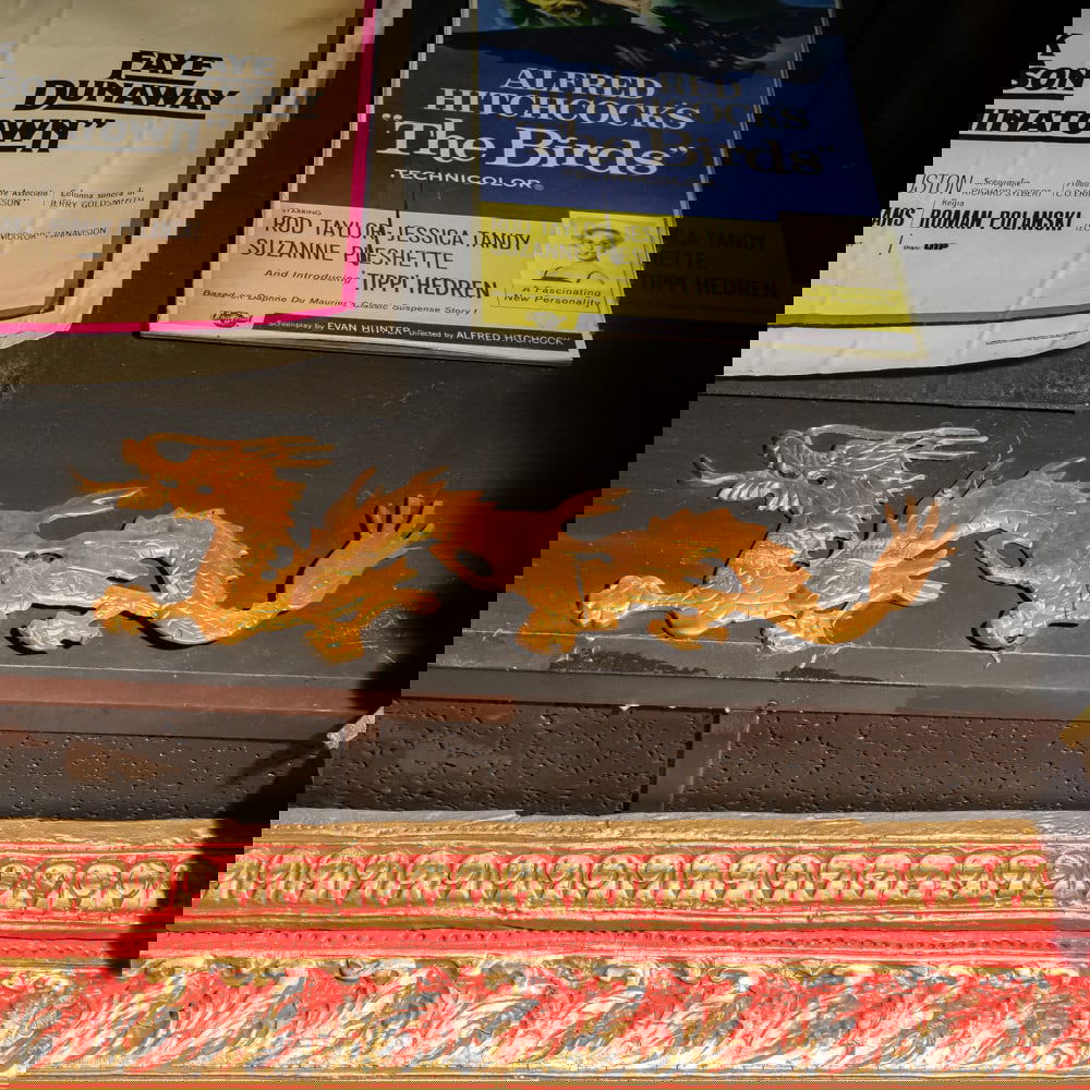 Pair of Brass R/L Facing Metal Dragon Motifs: Gold color cast right and left metal dragon measures 24" long, 8" tall. Please use photos to judge condition and bid accordingly. Please note: Buyer is responsible for removal. From the Hollywood Blvd