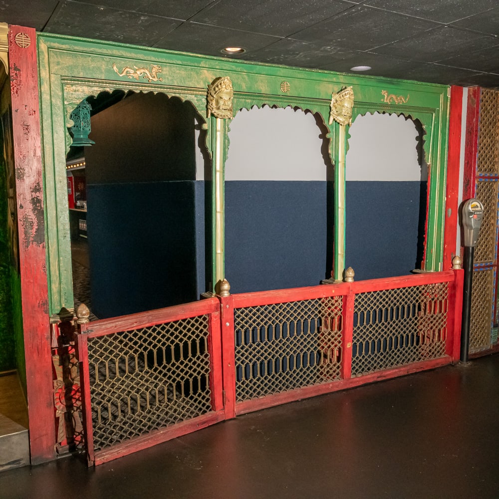 Carved Polychrome Wooden Entrance w/Gated Fence: A monumental architectural set featuring a green-painted, hand-carved facade and an integrated red-painted gated fence. The style is a high-drama interpretation of Chinoiserie, popular in early 20th-c