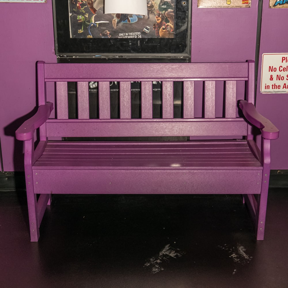 Purple Wood Bench Theater #1: Wood slat back bench painted purple in good condition. Measures 52.5" long X 34.25" tall X 25" deep. Please use photos to judge condition and bid accordingly. Please note: Buyer is responsible for rem
