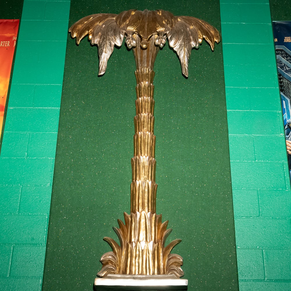 Gilded Palm Tree Wall Sconce Th. 3: This striking Hollywood Regency style palm tree wall relief features a brilliant gold-leaf or gilded finish over what appears to be a cast composite or heavy resin material. Evoking the mid-century gl