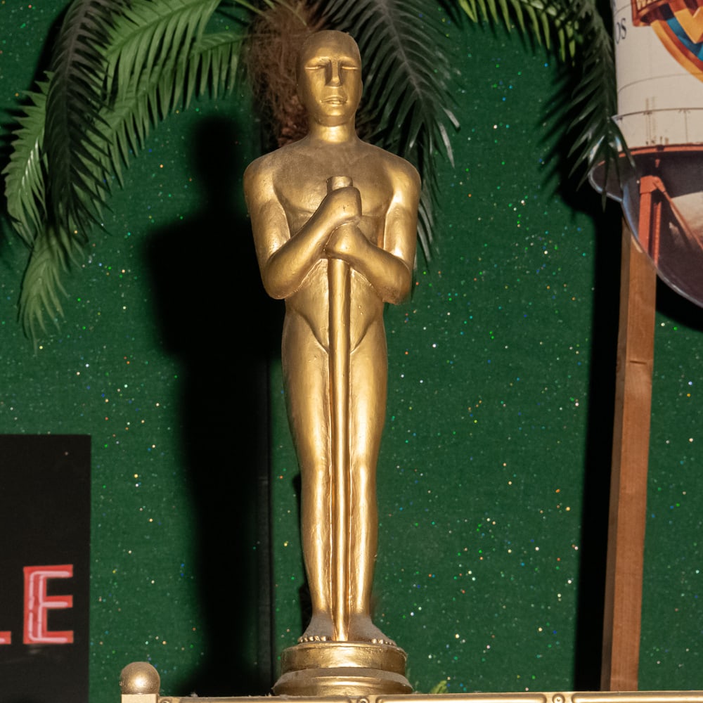 Academy Award Style Statue: Molded plastic 24" tall Academy Award style movie award statue. In good condition. Located on back wall of theater 3. Please use photos to judge condition and bid accordingly. Please note: Buyer is re