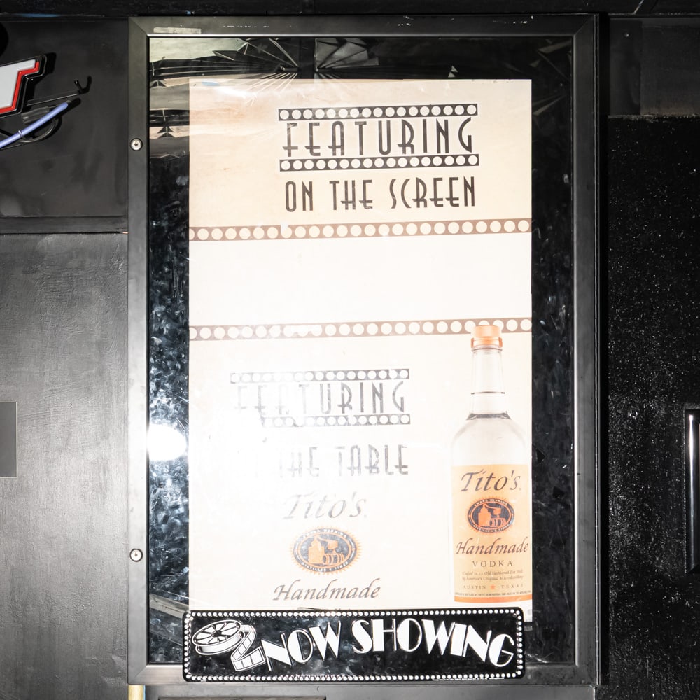 Now Showing Movie Poster Case: Back-lit Now Showing one sheet movie poster case in good condition located near the bar. Has lock and key. Overall measures 31" wide, 53.25" tall, 7" deep. Please use photos to judge condition and