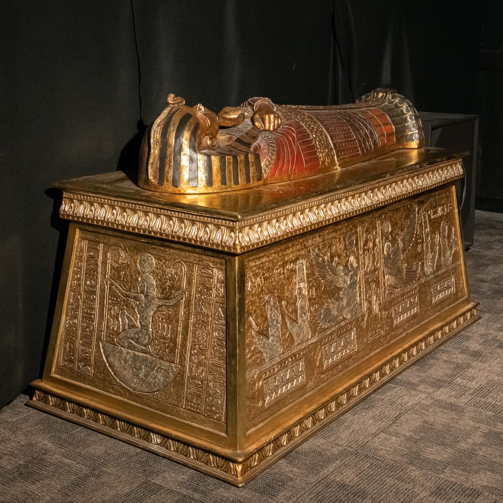 Fiberglass Egyptian Sarcophagus & Altar: Well made, molded fiberglass replica of King Tut's Sarcophagus on a molded fiberglass altar. Both pieces in VG condition. Sarcophagus measures 43" wide x 88" long x 49" tall Please use photos to judge
