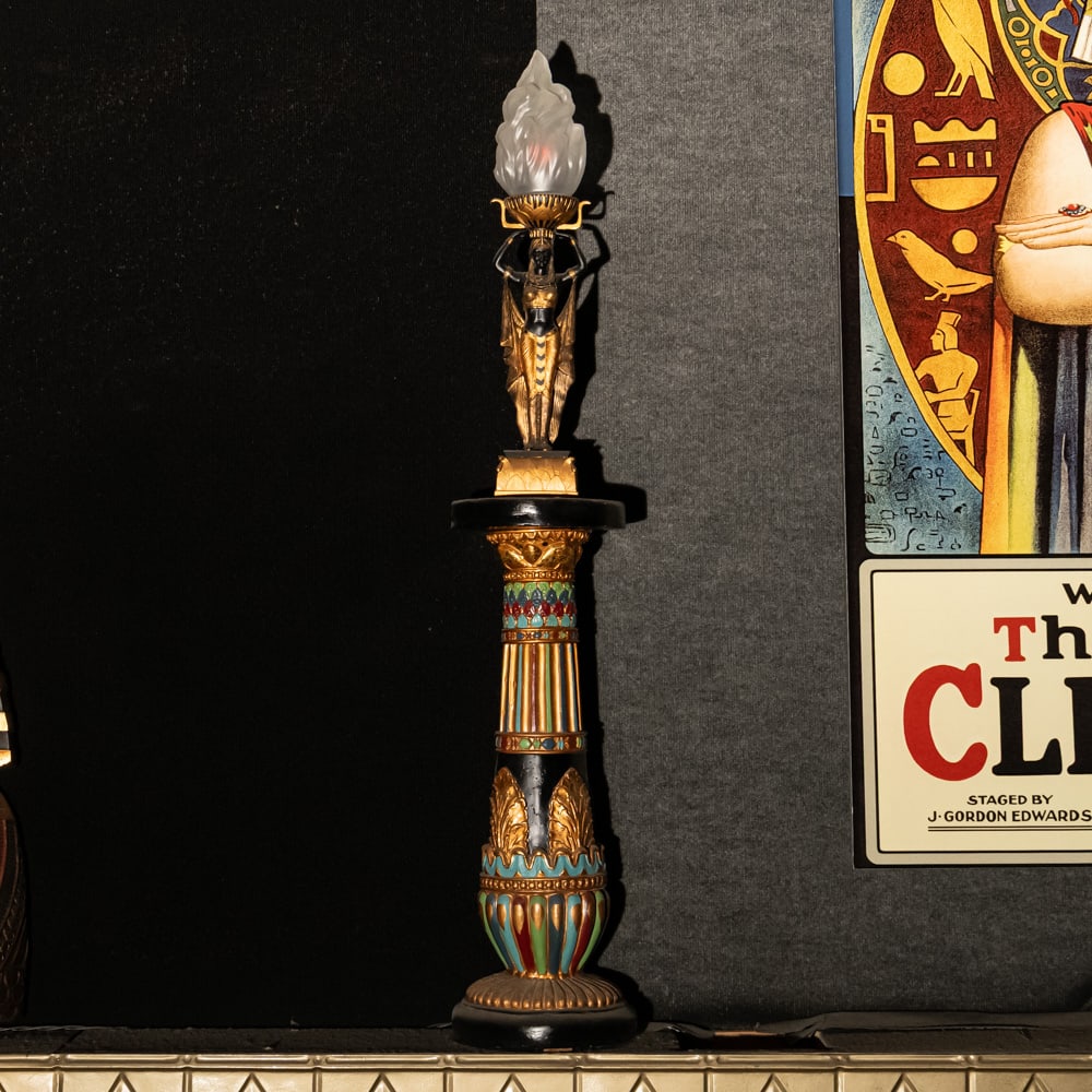 Egyptian Torch Lamp: A Golden Age Redux: Egyptian Torch Lamp: A Golden Age Redux. This striking figural lamp features a meticulously detailed Pharaoh sculpture in hand-painted resin, elevating an illuminated glass flame shade to create a dra