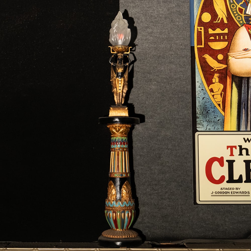 Egyptian Torch Lamp: A Golden Age Redux: Egyptian Torch Lamp: A Golden Age Redux. This striking figural lamp features a meticulously detailed Pharaoh sculpture in hand-painted resin, elevating an illuminated glass flame shade to create a dra