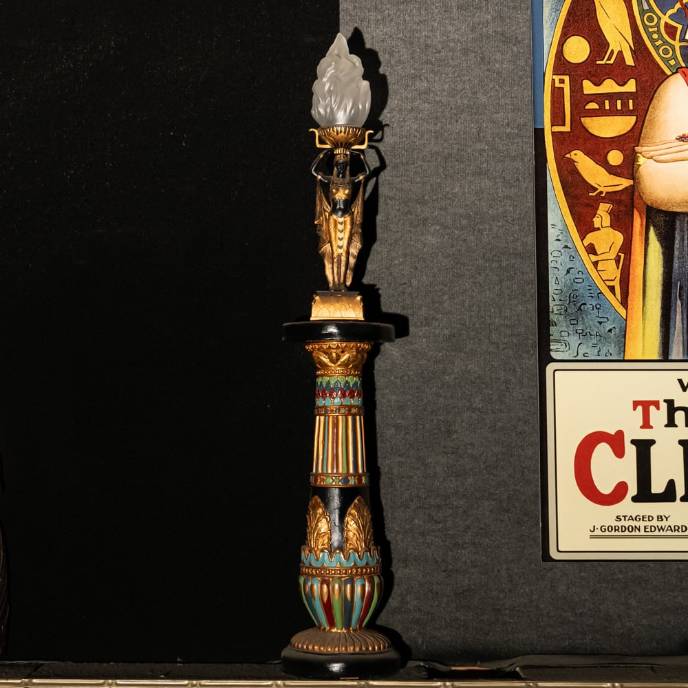 Egyptian Torch Lamp: A Golden Age Redux: Egyptian Torch Lamp: A Golden Age Redux. This striking figural lamp features a meticulously detailed Pharaoh sculpture in hand-painted resin, elevating an illuminated glass flame shade to create a dra