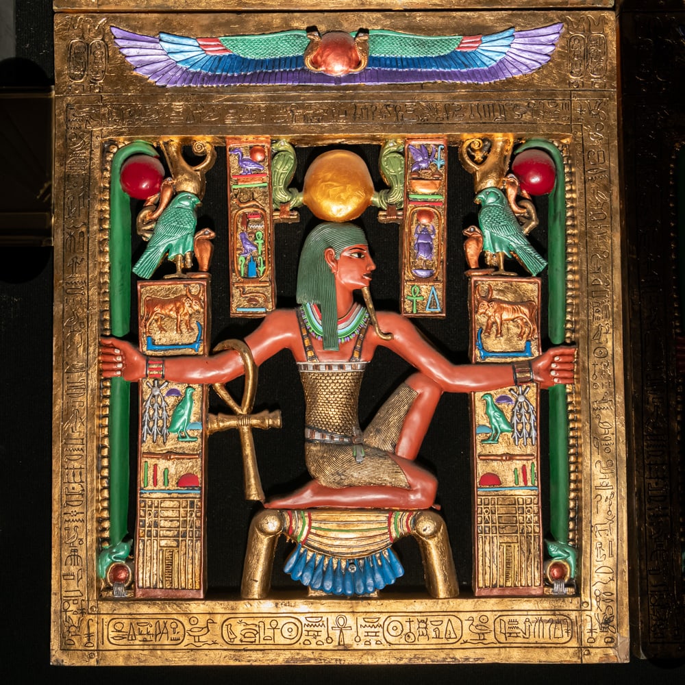 Egyptian Revival Heh Eternity Plaque: This stunning Egyptian Revival decorative plaque depicts the god Heh, the personification of infinity and eternity, rendered in a style reminiscent of the treasures found in Tutankhamun's tomb. The fi