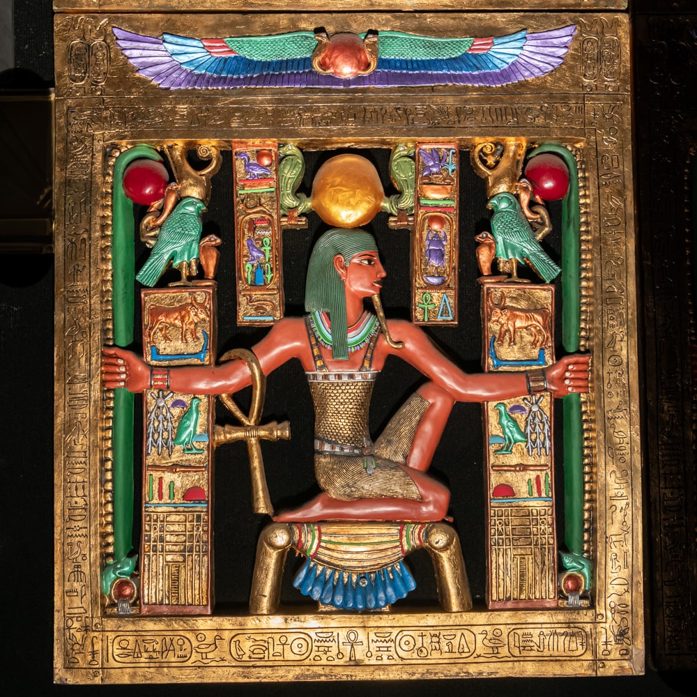 Egyptian Revival Heh Eternity Plaque: This stunning Egyptian Revival decorative plaque depicts the god Heh, the personification of infinity and eternity, rendered in a style reminiscent of the treasures found in Tutankhamun's tomb. The fi