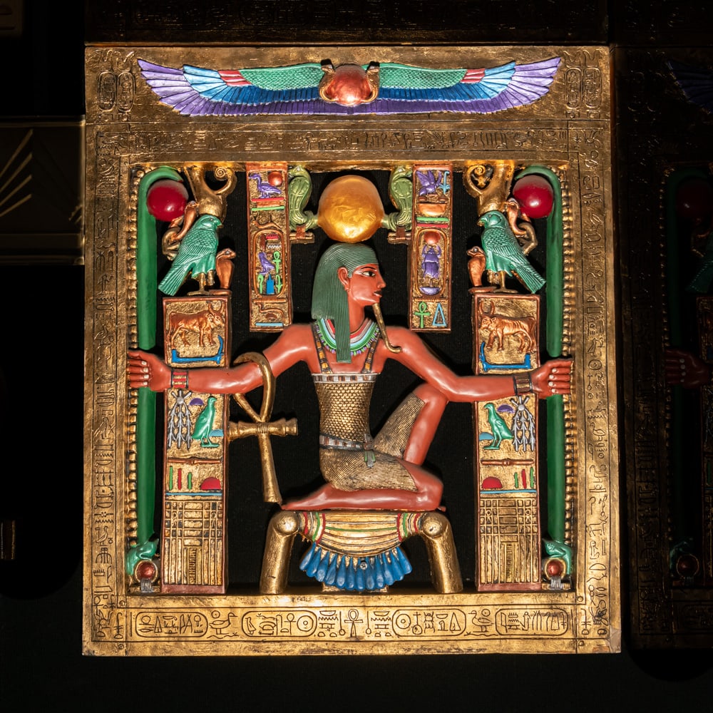 Egyptian Revival Heh Eternity Plaque: This stunning Egyptian Revival decorative plaque depicts the god Heh, the personification of infinity and eternity, rendered in a style reminiscent of the treasures found in Tutankhamun's tomb. The fi