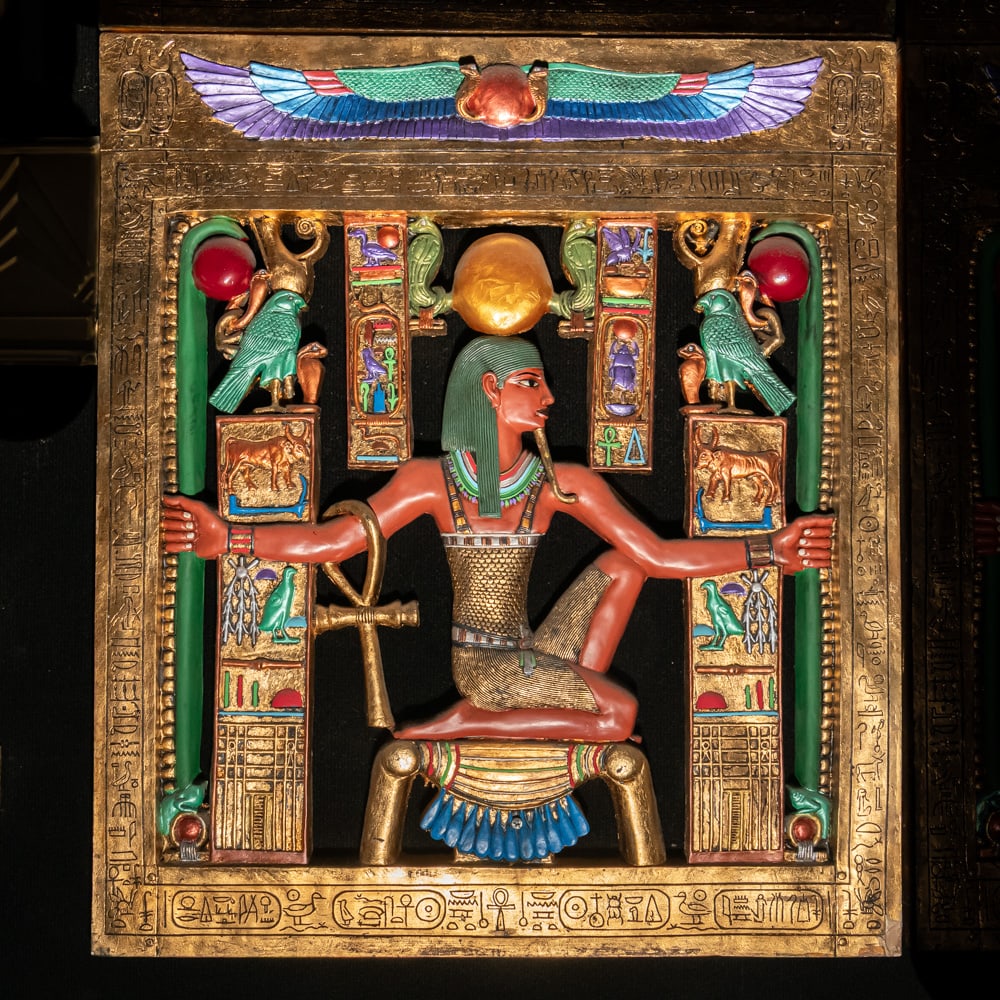 Egyptian Revival Heh Eternity Plaque: This stunning Egyptian Revival decorative plaque depicts the god Heh, the personification of infinity and eternity, rendered in a style reminiscent of the treasures found in Tutankhamun's tomb. The fi