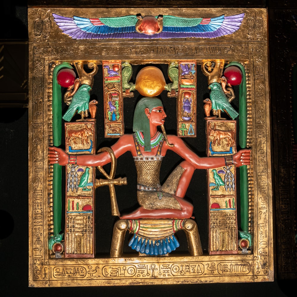 Egyptian Revival Heh Eternity Plaque: This stunning Egyptian Revival decorative plaque depicts the god Heh, the personification of infinity and eternity, rendered in a style reminiscent of the treasures found in Tutankhamun's tomb. The fi