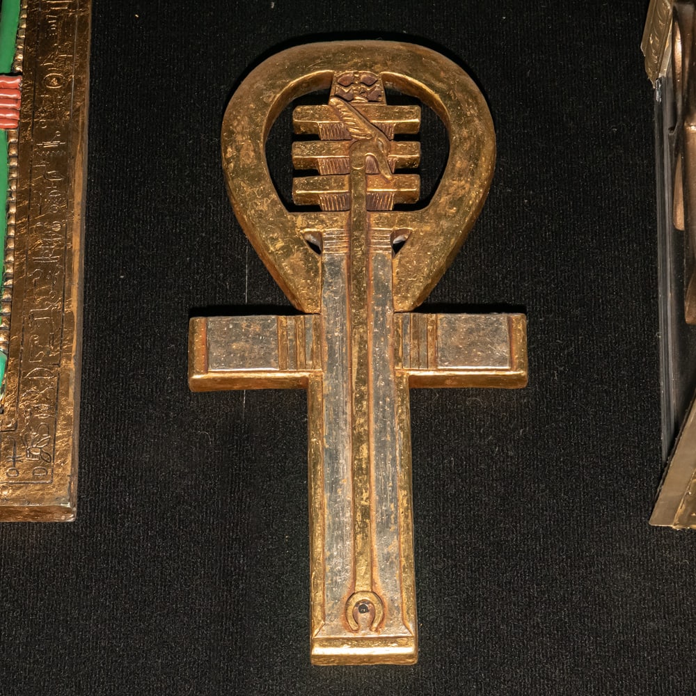 Ankn Symbol Of Life - Left: This striking piece is a stylized Egyptian Ankh, a timeless symbol of life, rendered with a unique decorative flair that incorporates elements of the Djed pillar (stability) and the Was-scepter (power