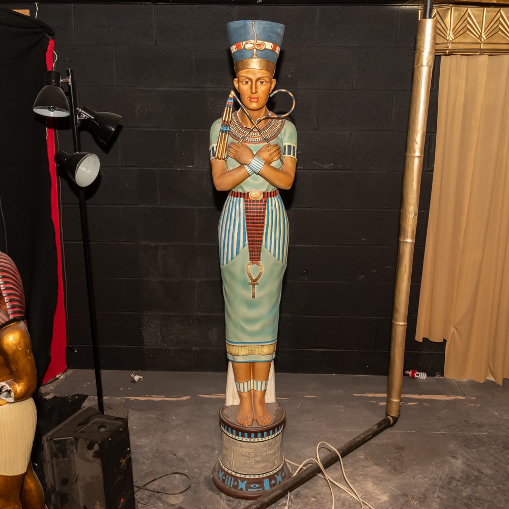 Egyptian Pharoah Floor Lamp-Electric: This striking life-size floor lamp captures the Regal "Egyptian Revival" aesthetic, featuring a figure in the likeness of a Pharaoh or high-ranking royalty. Crafted from molded resin or fiberglass,