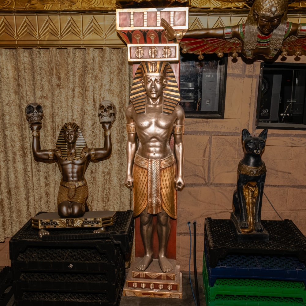 Life-Size Egyptian Pharaoh Resin Statue: This striking, life-size figure captures the regal essence of an Egyptian Pharaoh, likely inspired by the discovery of Tutankhamun's tomb. Crafted from heavy cast resin with a variegated bronze and
