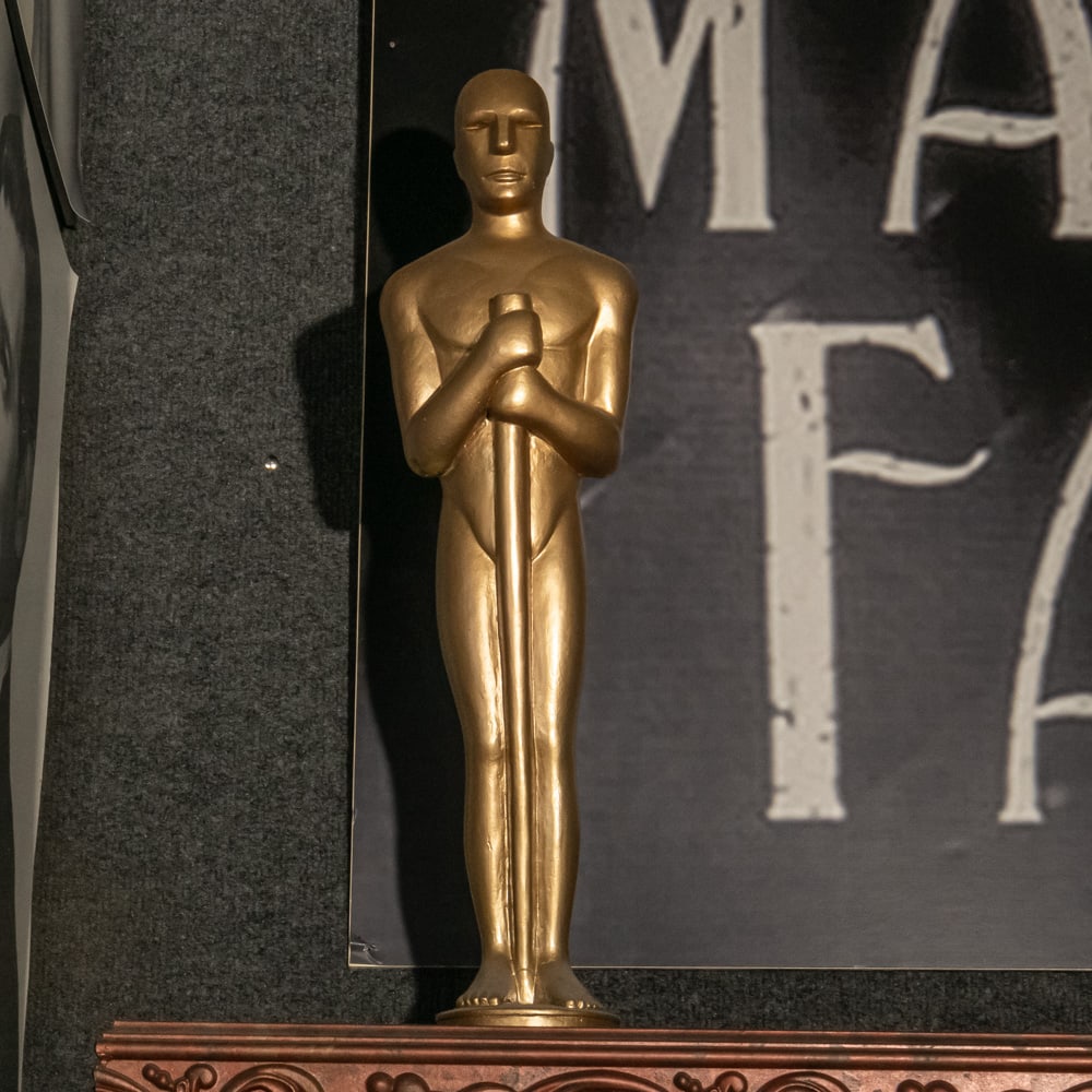 Academy Award Style Statuette: 27" tall plastic replica of an Academy Award statue in good condition. Please use photos to judge condition and bid accordingly. Please note: Buyer is responsible for removal. From the Hollywood