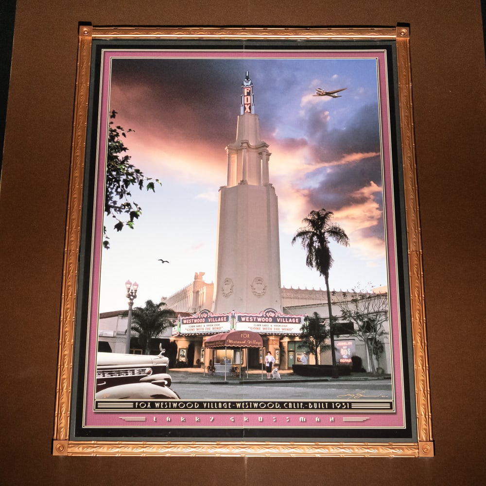 Larry Grossman Westwood Village Theater Mural: Large mural print of the Westwood Village Theater in Westwood California 1931 by artist Larry Grossman. Mounted on foam core board in 2 panels with a decorative metal frame. Measures 8' tall, 6' wide.