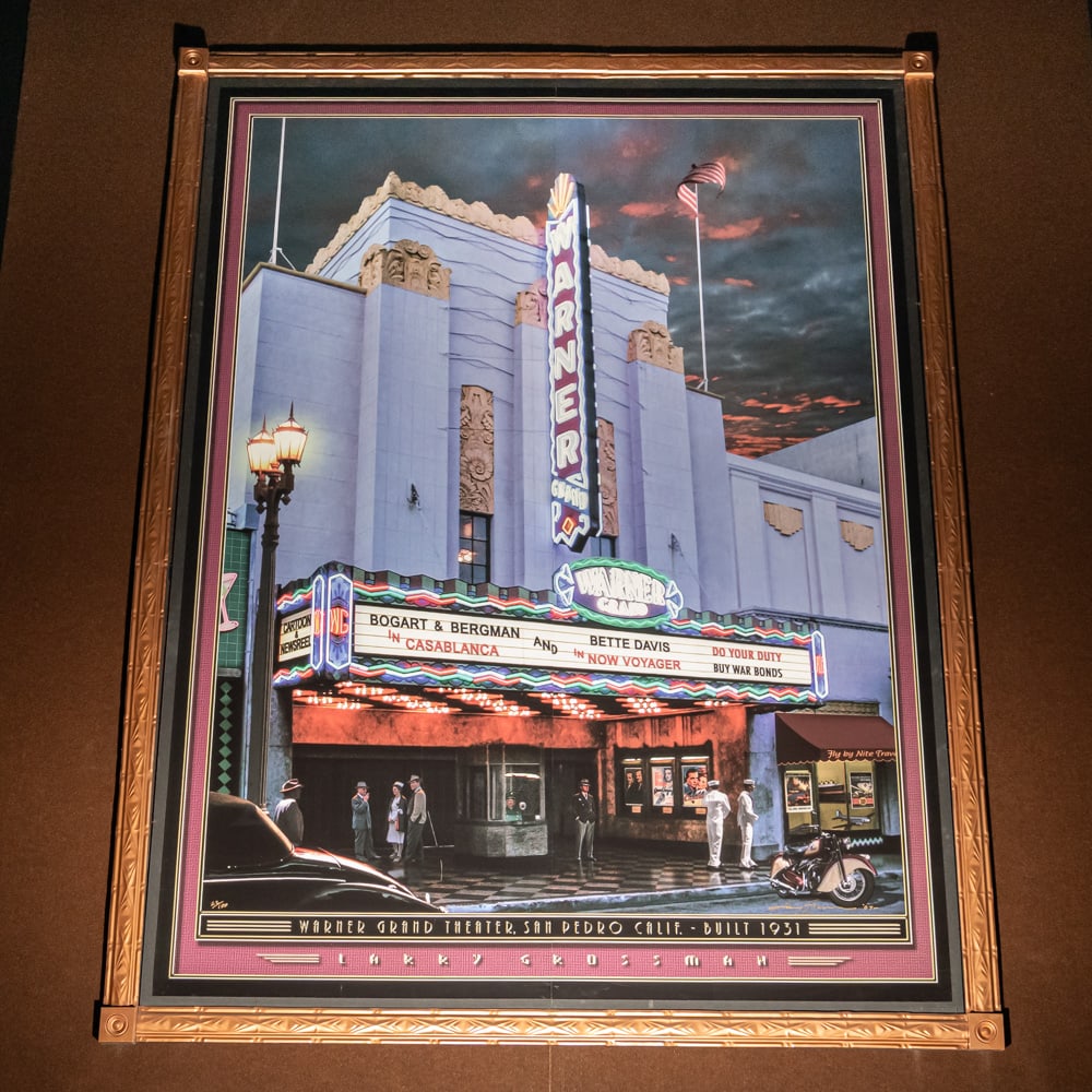 Larry Grossman Warner Grand Theater Mural: Large mural print of the Warner Grand Theater in San Pedro California 1931 by artist Larry Grossman. Mounted on foam core board in 2 panels with a decorative metal frame. Measures 8' tall, 6' wide.
