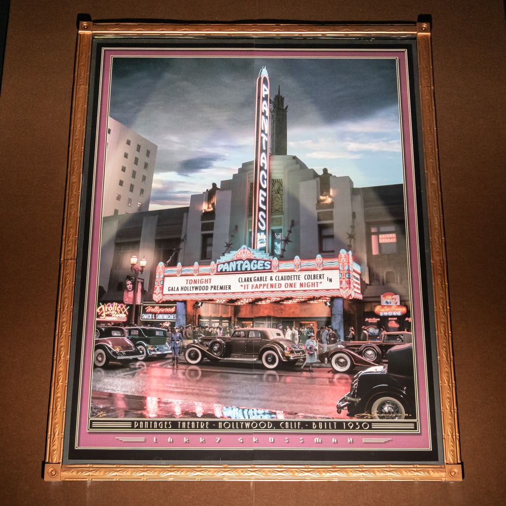Larry Grossman Pantages Theater Mural: Large mural print of the Pantages Theater in Hollywood California 1930 by artist Larry Grossman. Mounted on foam core board in 2 panels with a decorative metal frame. Measures 8' tall, 6' wide. From t