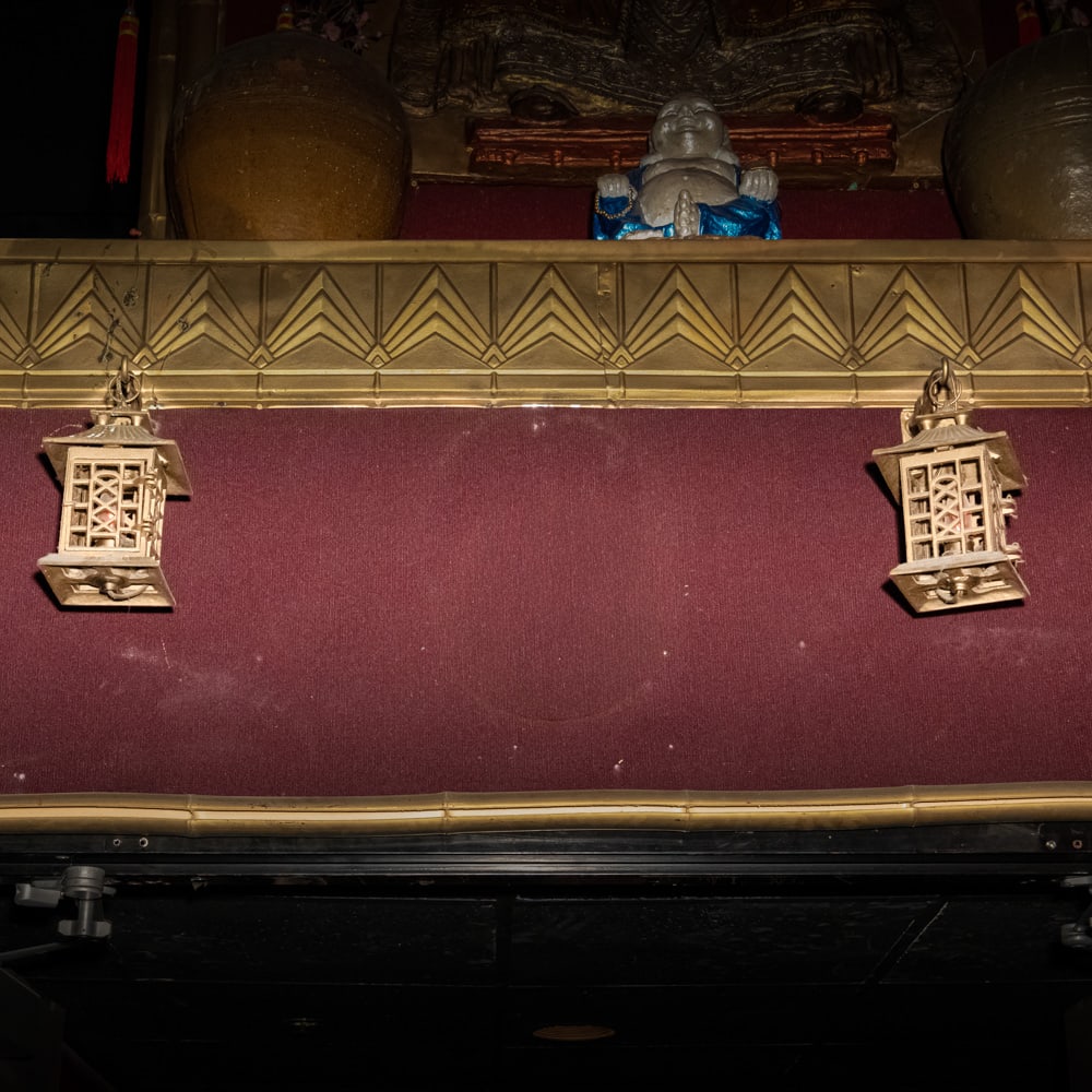 Vintage Brass Pagoda Wall Lantern Pair-Lower: This striking pair of electrified wall lanterns features a classic Chinoiserie pagoda silhouette, likely dating from the mid-20th century. Cast in a durable brass-finished metal, the fixtures showcase