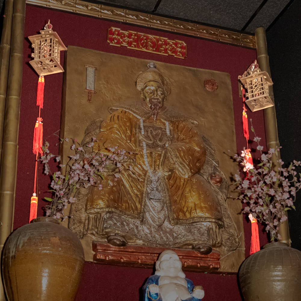 Vintage Brass Pagoda Wall Lantern Pair-Upper: This striking pair of electrified wall lanterns features a classic Chinoiserie pagoda silhouette, likely dating from the mid-20th century. Cast in a durable brass-finished metal, the fixtures showcase