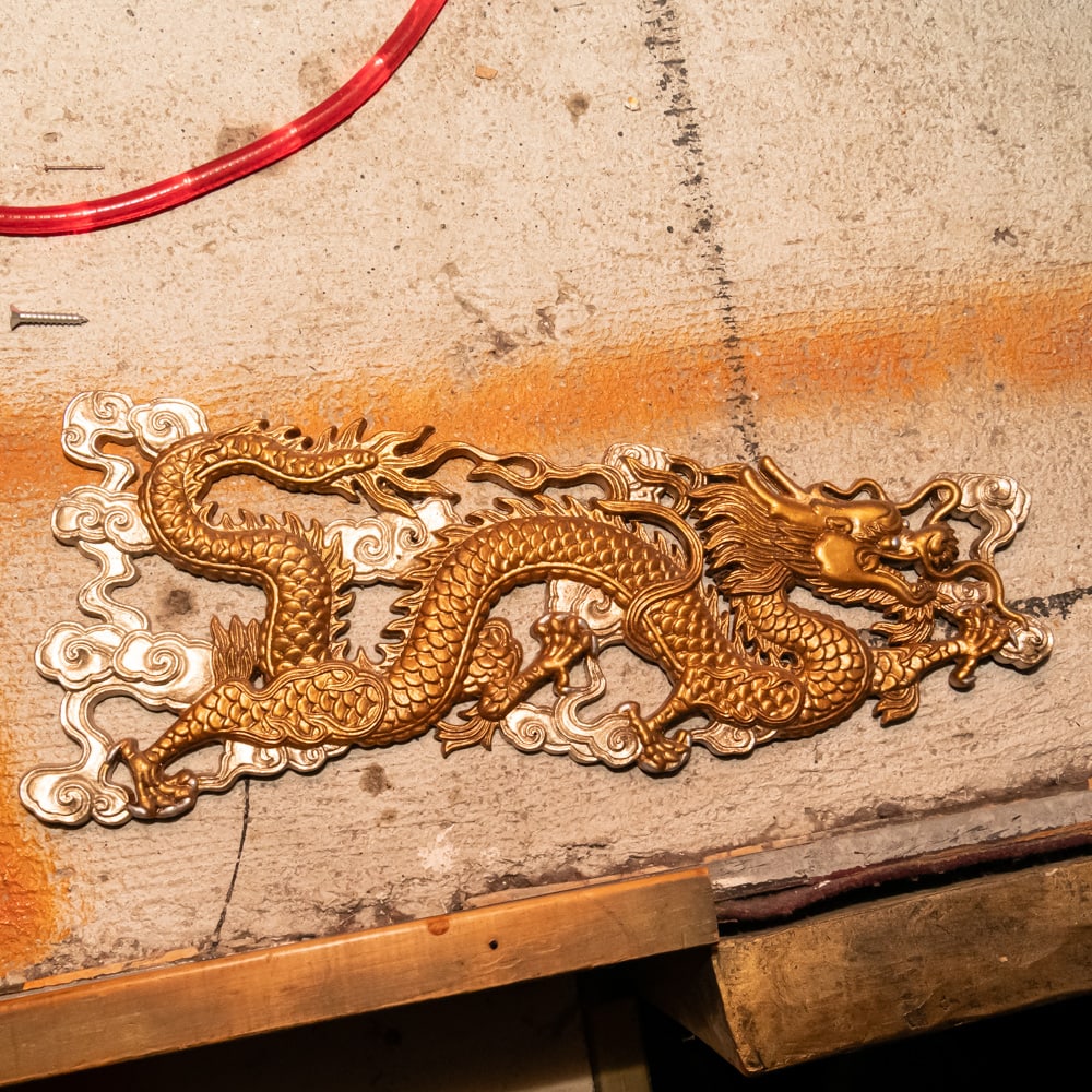 4 Gilt Dragon & 2 Medallion Wall Appliques (6): This set of six ornate architectural appliques includes four serpentine dragons and two multi-sided floral medallions, all exhibiting a rich, antiqued gold-tone finish. As a collector of high-end deco