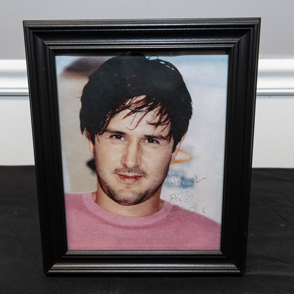 Framed Signed David Arquette 8x10 Color Photo: This is a charming piece of pop-culture memorabilia featuring actor David Arquette, widely recognized for his role as Dewey Riley in the Scream series. The color photograph displays a hand-signed insc