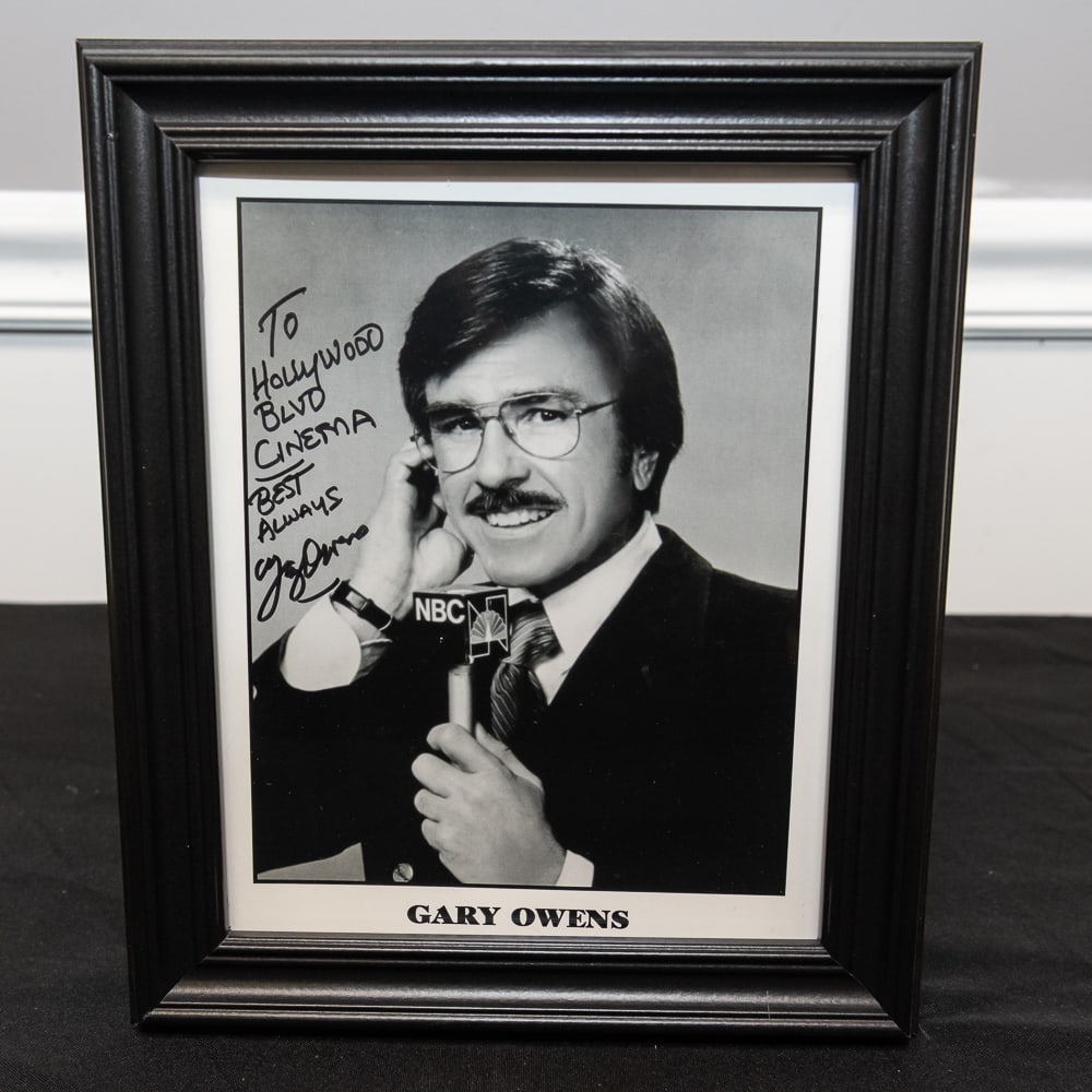 Framed Autographed Gary Owens NBC Portrait 8x10: This is a classic piece of broadcasting history featuring the legendary "Voice of Hollywood," Gary Owens. Best known for his droll, baritone delivery on Rowan & Martin's Laugh-In, Owens is captured he