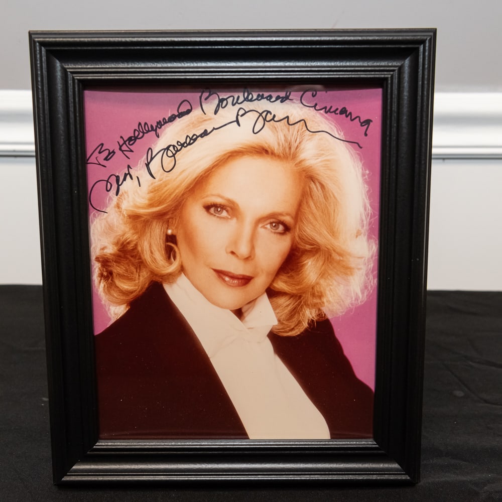 Framed Signed Roxanne Ryan Framed Photo 8x10: This is a classic 1980s-era promotional headshot of actress Roxanne Ryan, personalized in black ink to "Hollywood Boulevard Cinema." Ryan, known for her roles in films like The Last Dragon (1985) and