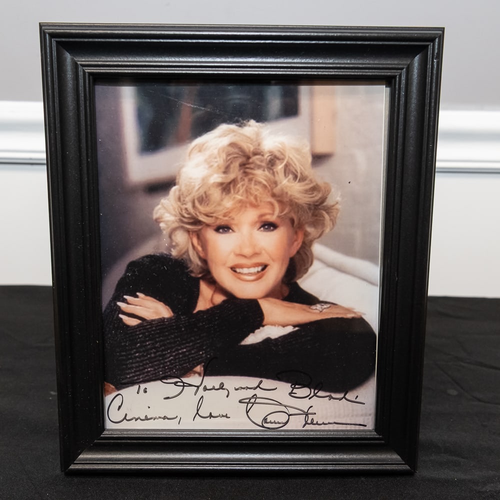 Framed Autographed Connie Stevens 8x10 Photo: This is a vibrant, color promotional photograph of the multi-talented American actress and singer Connie Stevens, featuring a personalized ink signature and inscription. Stevens, a staple of 1960s pop