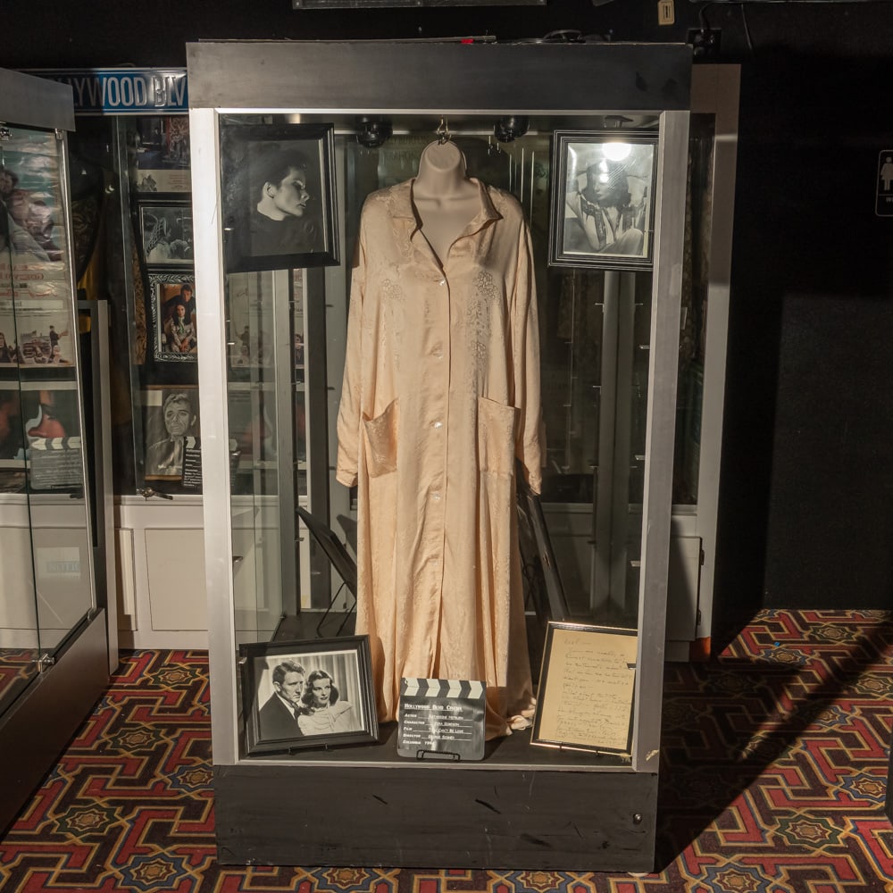 Large Glass Display Showcase: Glass on 4 sides with aluminum frame. Two hinged doors on one side for entry. Showcase lit (untested) on wheels. Measures: 73" tall x 40" wide x 40" deep. No contents included Please use photos to jud