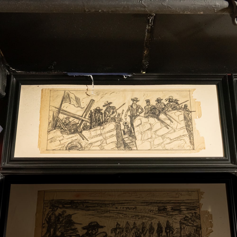 John Jensen Original Alamo Storyboard Sketch 1: Framed original storyboard pencil sketch by John Jensen for the 1960 film, The Alamo. One of 6 original Alamo sketches in this auction, it depicts Travis on a wall lighting the fuse of a cannon. 