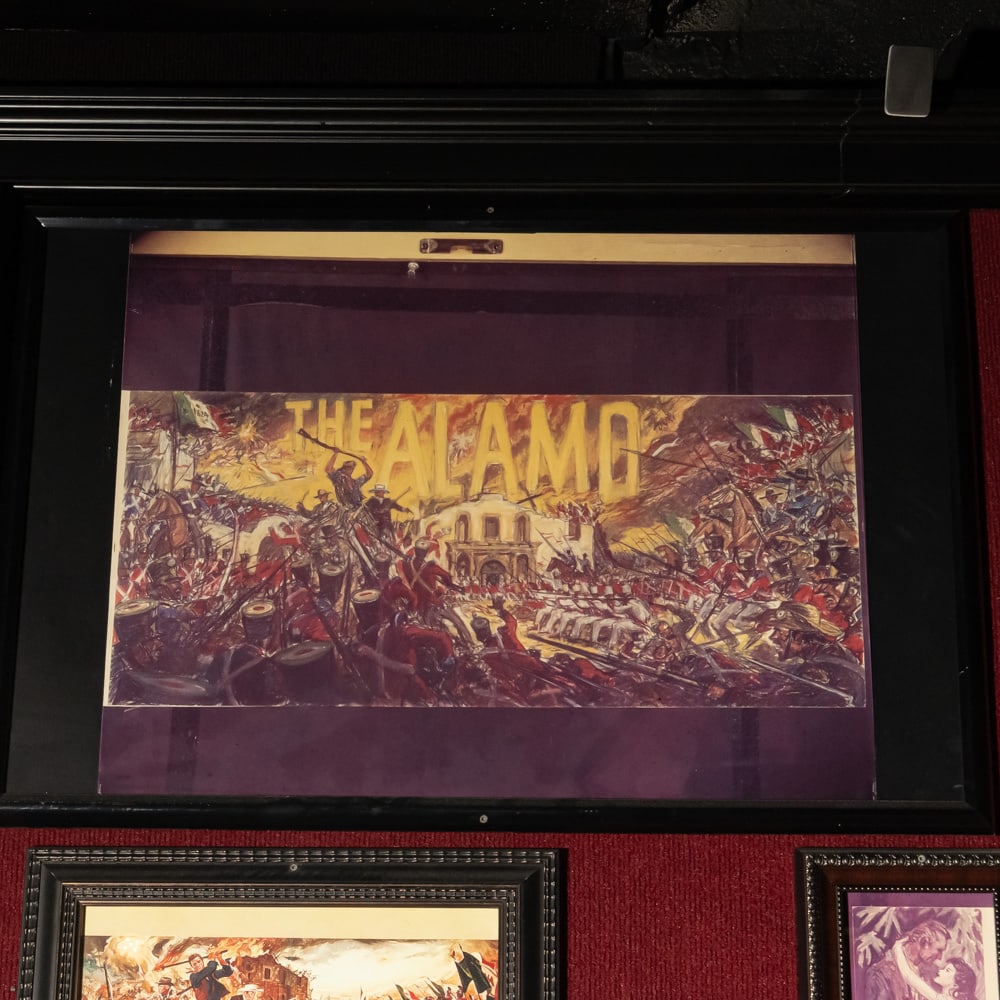 Original The Alamo Animation Cell Sheet: This striking original animation cell sheet captures the climactic fury of the Battle of the Alamo with a stylized, cinematic energy. Rendered in a dynamic mid-century illustrative style, the