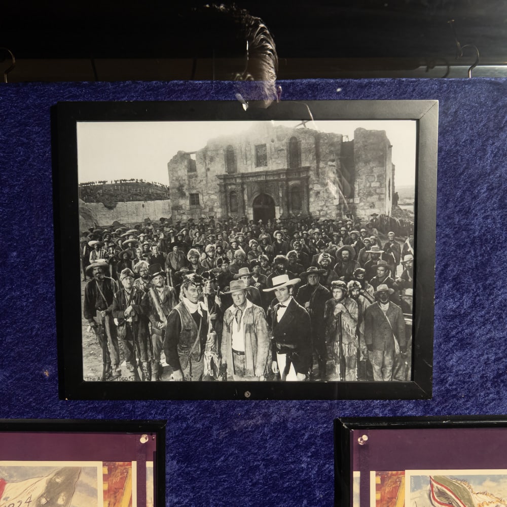 The Alamo Movie B&W Cast Photo: Approx 11"x14" B&W cast photo of the 1960 movie, The Alamo. Stars John Wayne, Richard Widmark, and Laurence Harvey stand in front of over 100 cast members and the Alamo mission set. In good