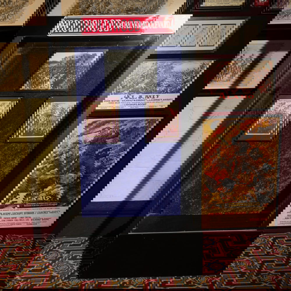 Glass Showcase: Tall glass showcase with glass on all 4 sides with 2 sliding glass doors. In good condition. Measures 39" wide, 73" tall, 17" deep. Does not include contents sold as separate lot. Please use photos to