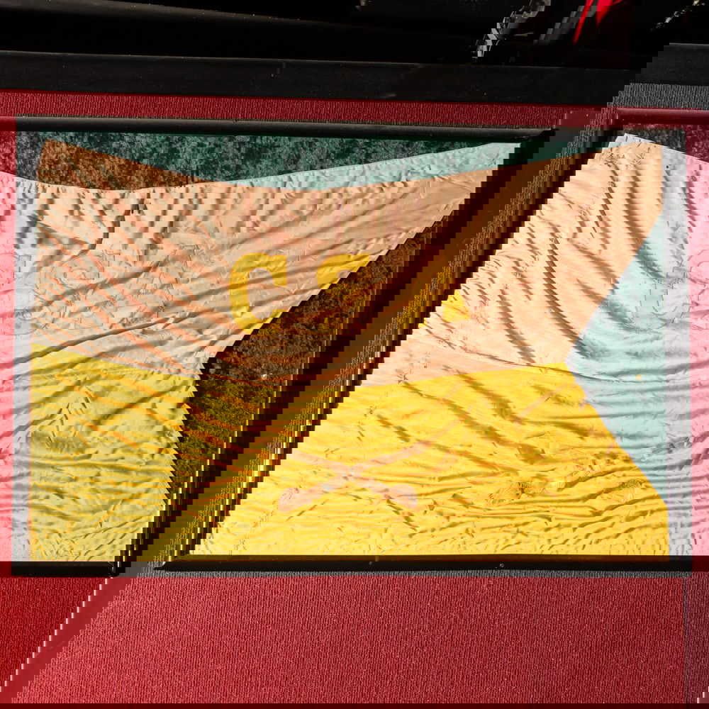 CSA Cavalry Guidon: High quality framed swallow tail cavalry guidon in good condition. Hand sewn CSA and crossed cavalry sabers. Colors have faded. Vintage unknown. In good condition. Frame measures 41" wide, 28"