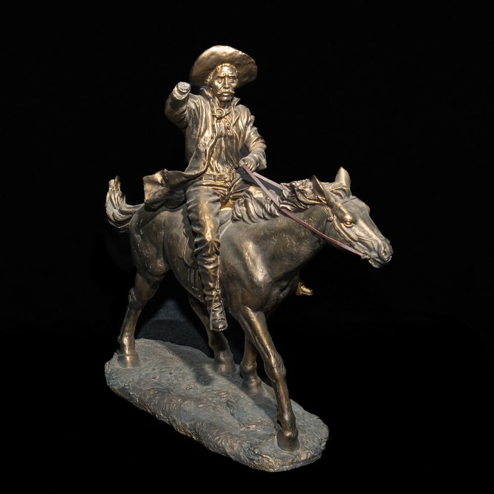 Cast Resin Cowboy Equestrian Statue: This dynamic equestrian sculpture captures a frontiersman in mid-gallop, reminiscent of the spirited Western bronzes popularized by artists like Frederic Remington. Cast in a heavy resin with a classi