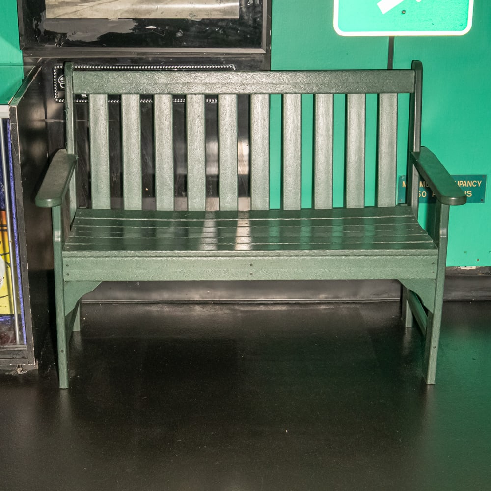 Green Wood Bench: Wood bench with slat back painted green outside of theater #3. In good condition. Measures 48" wide X 35" tall X 23" deep. Please use photos to judge condition and bid accordingly. Please note: Buyer