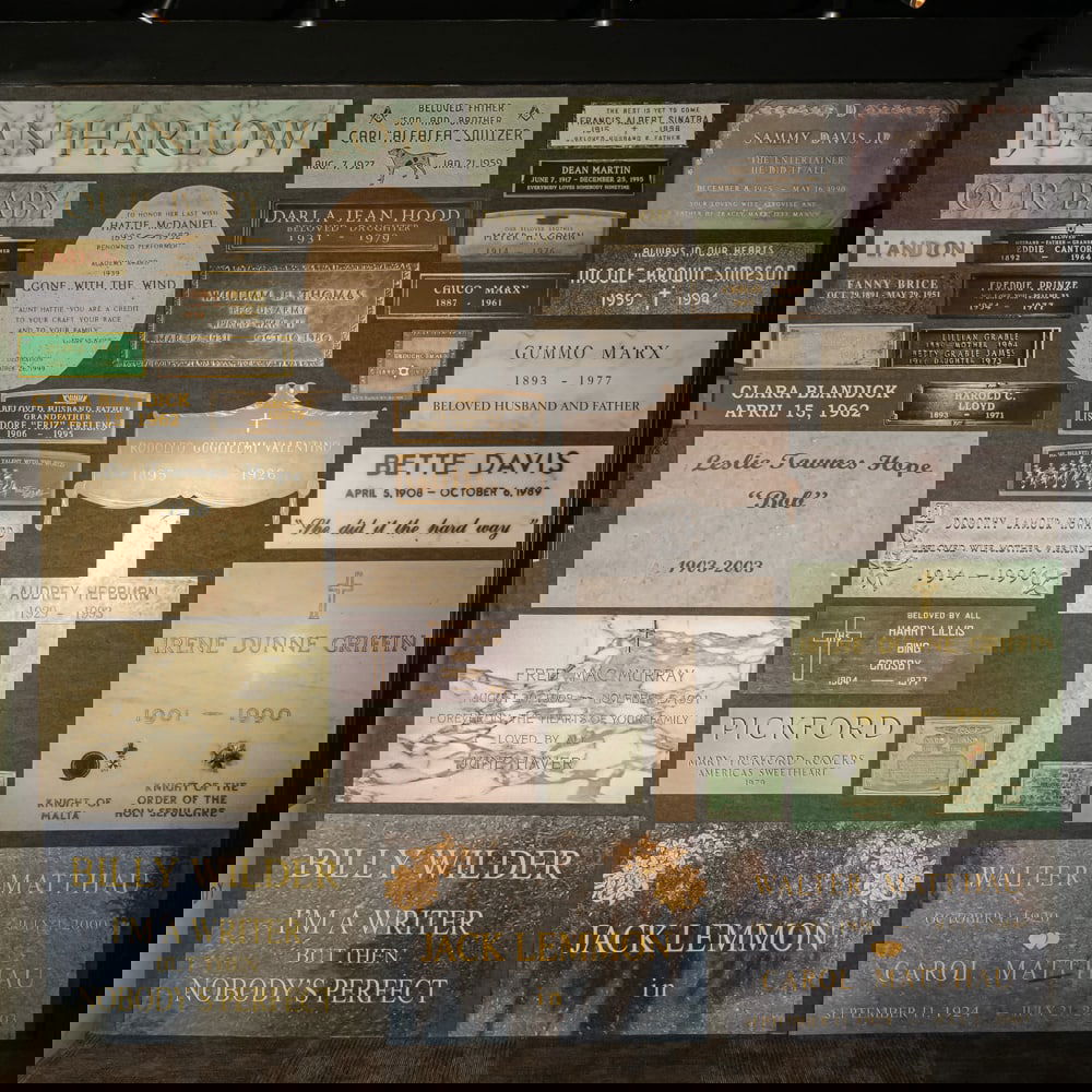 Movie Star Grave Marker Photographs No. 1: One wall of color photographs mounted on foam core board featuring famous movie star grave markers. Please use photos to judge condition and bid accordingly. Please note: Buyer is responsible for remo