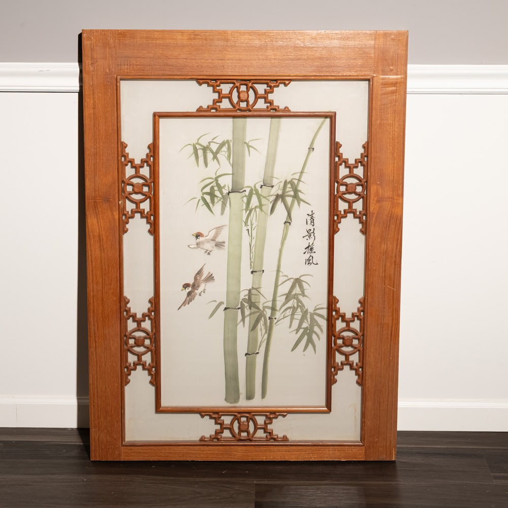 Asian Bamboo & Birds Framed Wood Panel: This elegant Chinoiserie-style decorative wall panel features a central silk or paper insert depicting a serene scene of sparrows among bamboo stalks, accented by Chinese calligraphy. The artwork is h