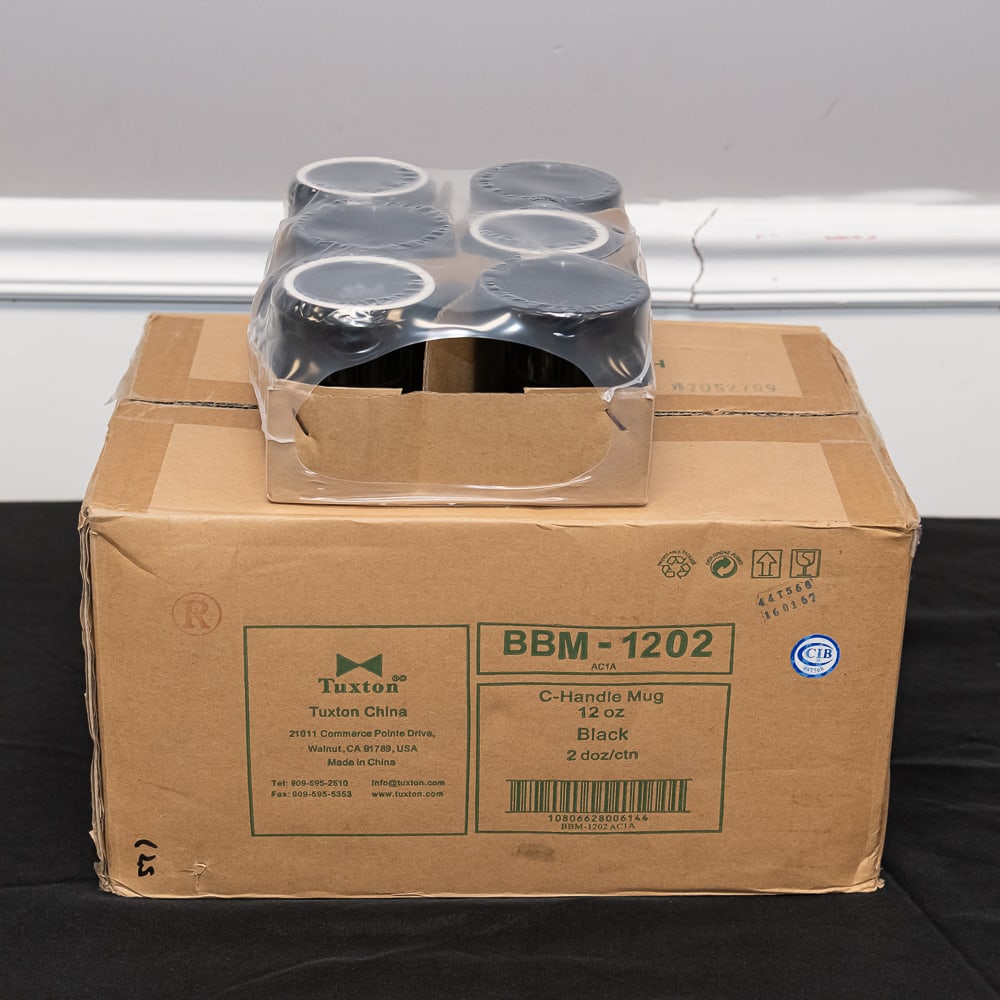 24 Tuxton Black C-Handle Mugs 12oz: This lot features a full case of 24 professional-grade "C-Handle" mugs manufactured by Tuxton China, a staple in the restaurant and hospitality industry known for durability and classic design. These
