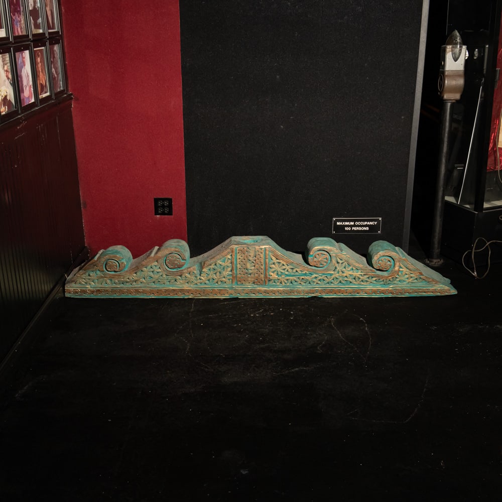 Antique Indo-Persian Carved Wood Corbel: This striking architectural element is a hand-carved corbel, likely of Indo-Persian or Swat Valley origin, featuring intricate floral rosettes, geometric chip-carving, and prominent scrolled volutes.