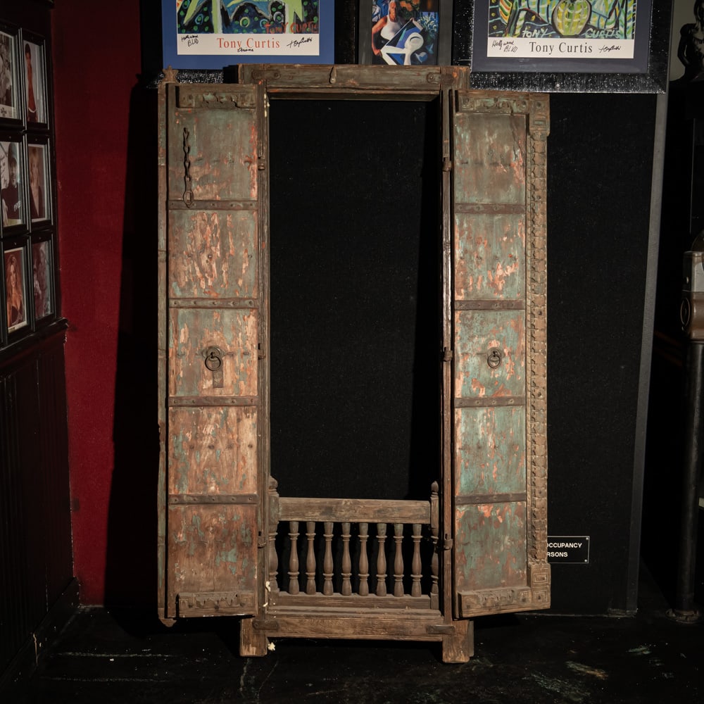 Antique Indian Hand-Carved Haveli Door: This is a magnificent example of a 19th-century Indian Haveli door, likely originating from the Rajasthan or Gujarat regions. Crafted from heavy, solid teak or tropical hardwood, it features a traditi