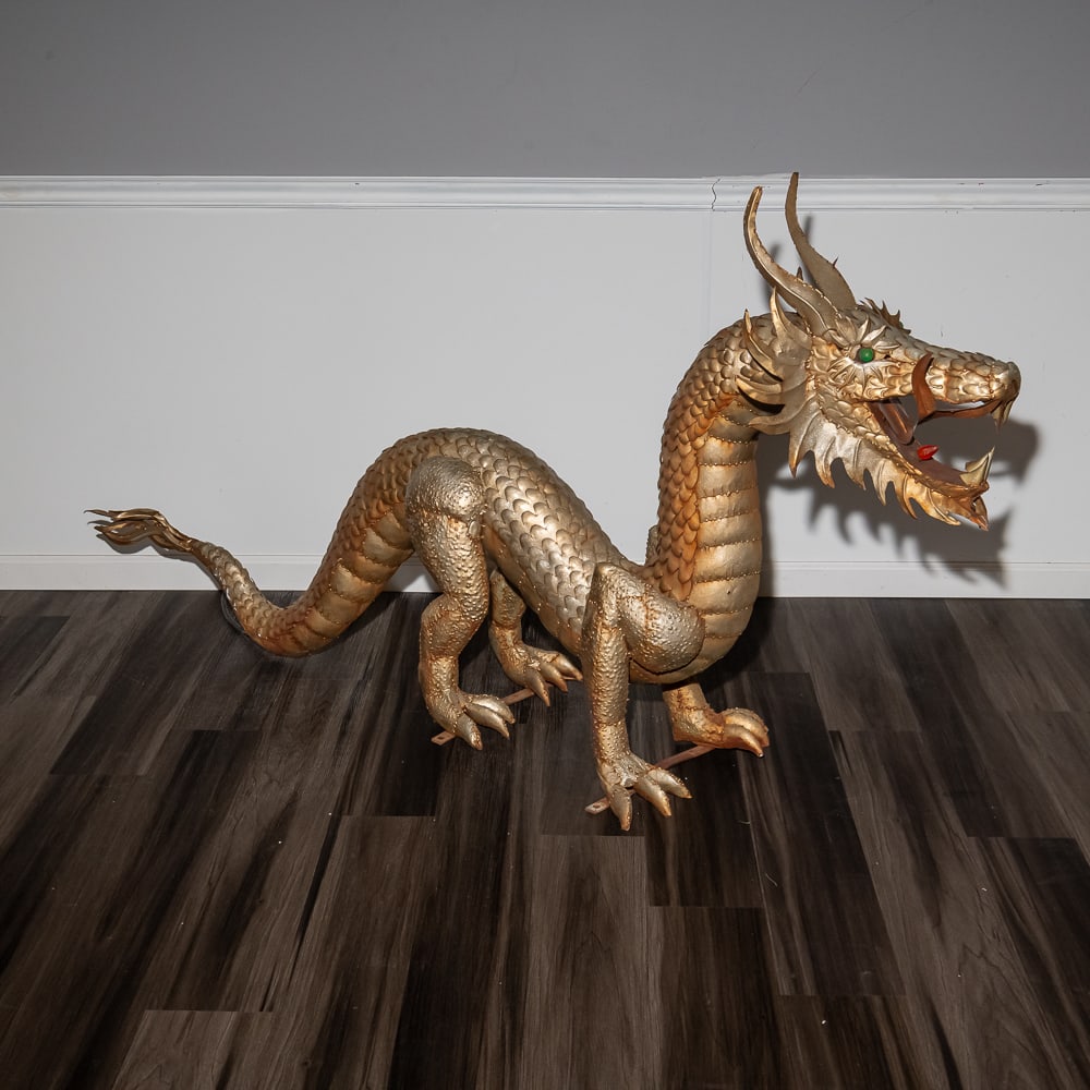 Metal Dragon: Very well done contemporary metal dragon sculpture made from welded sheet metal. Mounting brackets on feet. Eyes have light bulbs but will need rewiring. Measures 12" wide X 84" long X 43" tall. Pleas