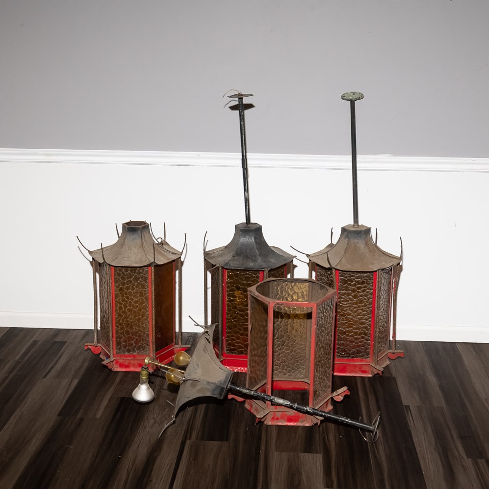 Antique Asian-Style Hexagonal Lanterns (4): These striking lanterns evoke a Mid-Century "Orientalia" aesthetic, featuring a classic hexagonal pagoda-style silhouette. The frames are constructed of metal with a weathered red finish, complemented