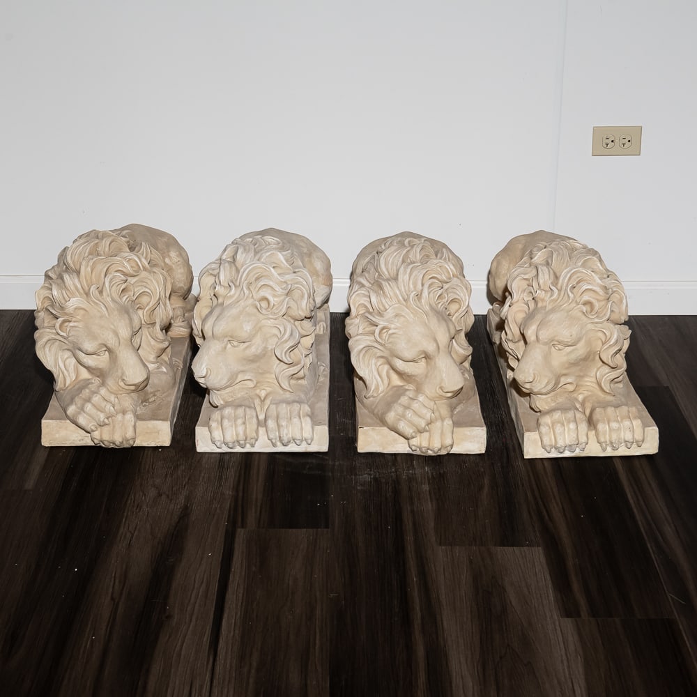 4 Faux Stone Laying Lions: Lot of 4 faux stone laying lions in good condition with some breaks and missing pieces. See pics. Made of plastic to look like carved stone.. Each measure 11" wide X 29"long X 14.5" tall. Buyer respon