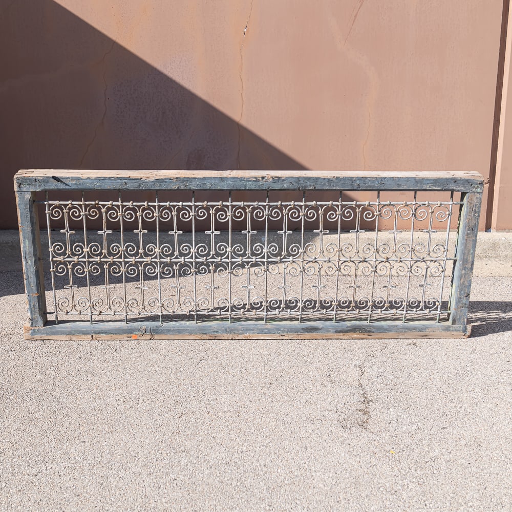 Indo-Colonial Fence Section: Indo-Colonial Wrought Iron Gate InsetThis architectural gate is a classic example of Indo-Colonial or Anglo-Indian craftsmanship, frequently exported from Northern India (often the Rajasthan or Gujara