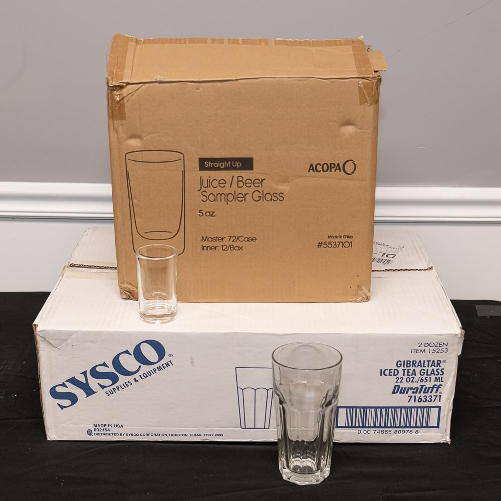 96pc Acopa & Sysco Glassware Set: This collection features two professional-grade sets of glassware, perfect for a home bar or commercial transition. Included are 72 Acopa "Straight Up" 5 oz. juice or beer sampler glasses, characteriz
