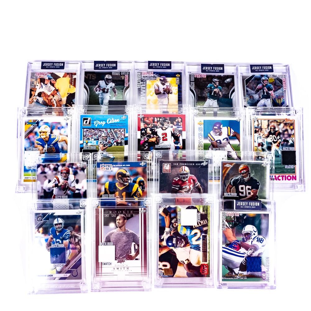 (18) Assorted 2021 & 2022 Jersey Fusion NFL Cards: Collection of (18) assorted NFL 2021 & 2022 Jersey Fusion "slabbed" cards including Warren Moon, Boomer Esiason, Alvin Kamara, Carson Wentz, Joey Bosa, John Randle, Greg Olsen, Matt Ryan, Devonta