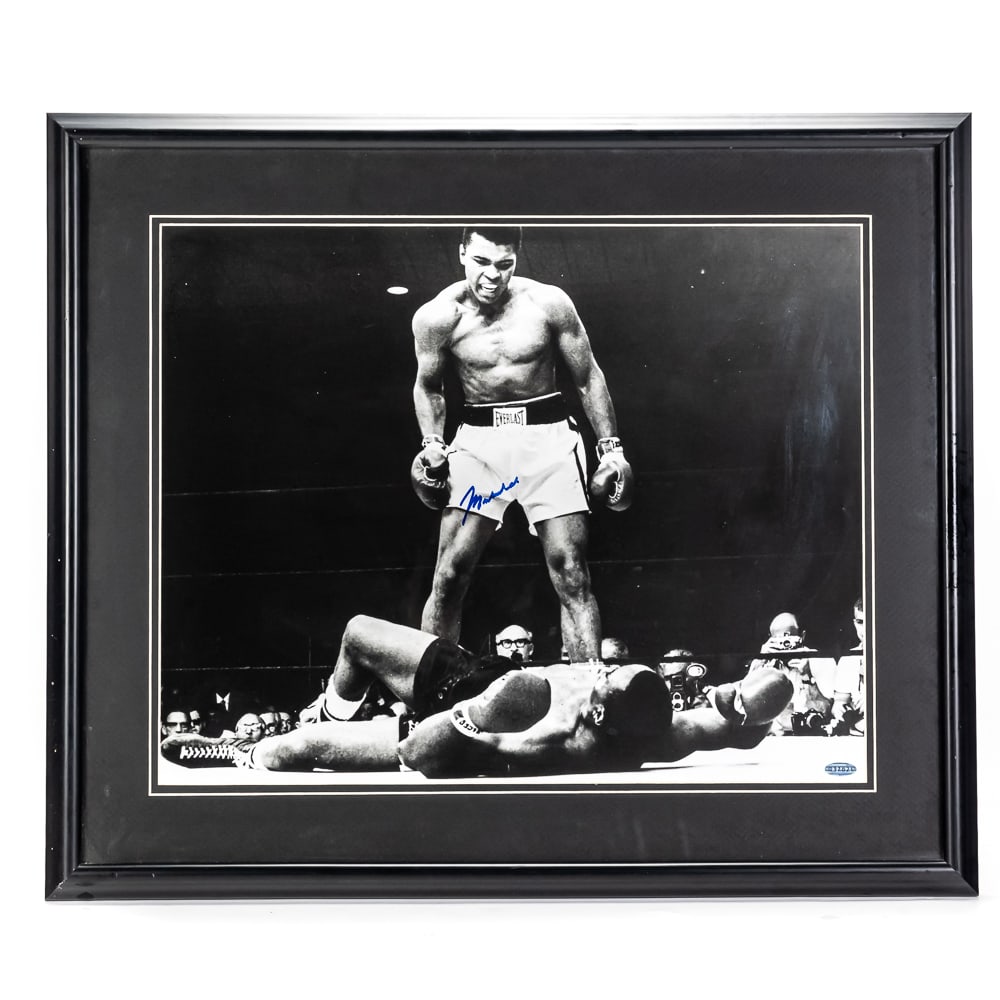 ALI Over Liston AUTOGRAPHED Framed Photo w COA: Framed Muhammad Ali AUTOGRAPHED "Ali over Liston" photo with Steiner hologram COA. Attractive vintage black and white photo perfectly presented inside a classic black frame with black matting with whi